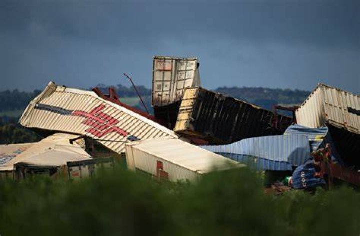 
Australian train derails from flooded tracks in horrific scene 
