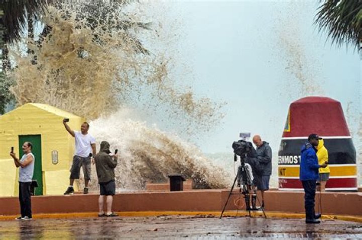 
Hurricane Ian downgraded as it moves out to sea, swamps NYC region 