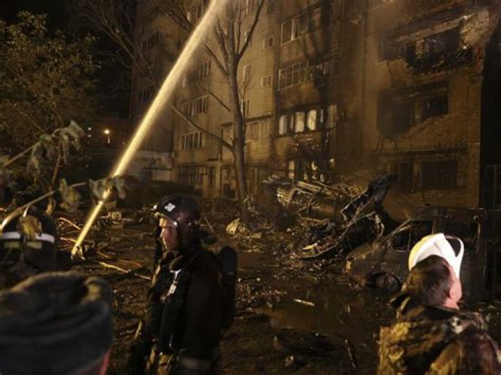 
Russian warplane crashes near apartment building, killing 13 